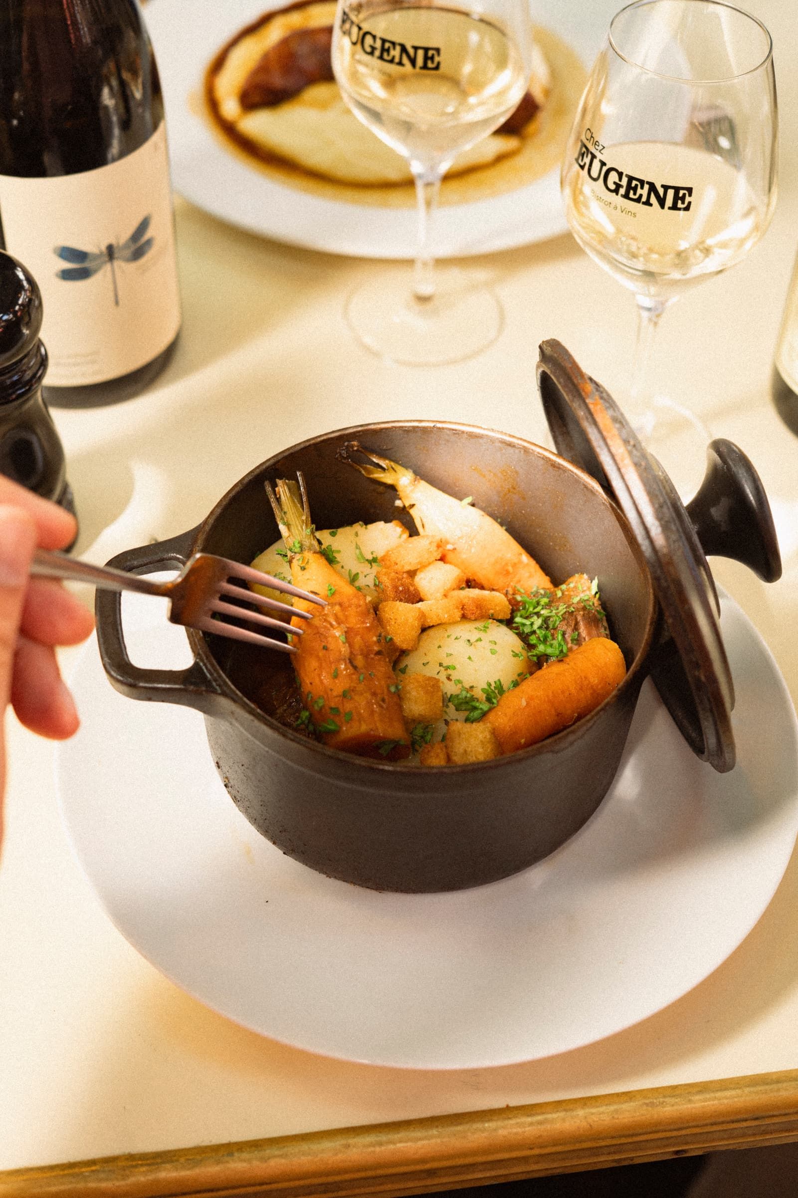 A steaming casserole, fork planted in it