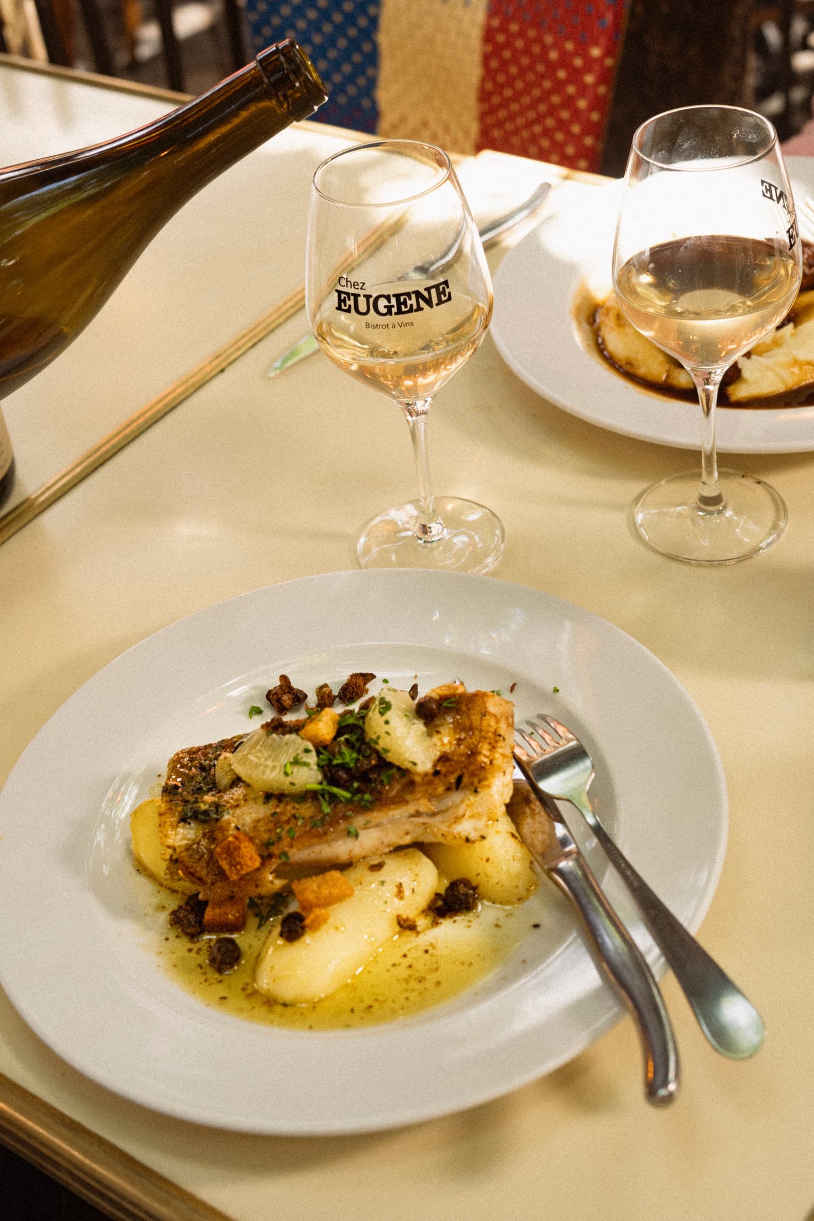 A fish with buttered potatoes